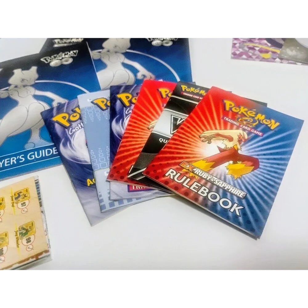 MASSIVE GAME FREAK POKEMON TCG CARD LIST RULEBOOK & PLAYMAT LOT W MORE